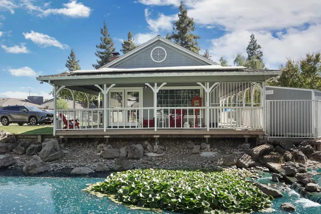 a front view of house with a garden