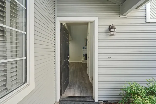 a view of a porch with a table and chair