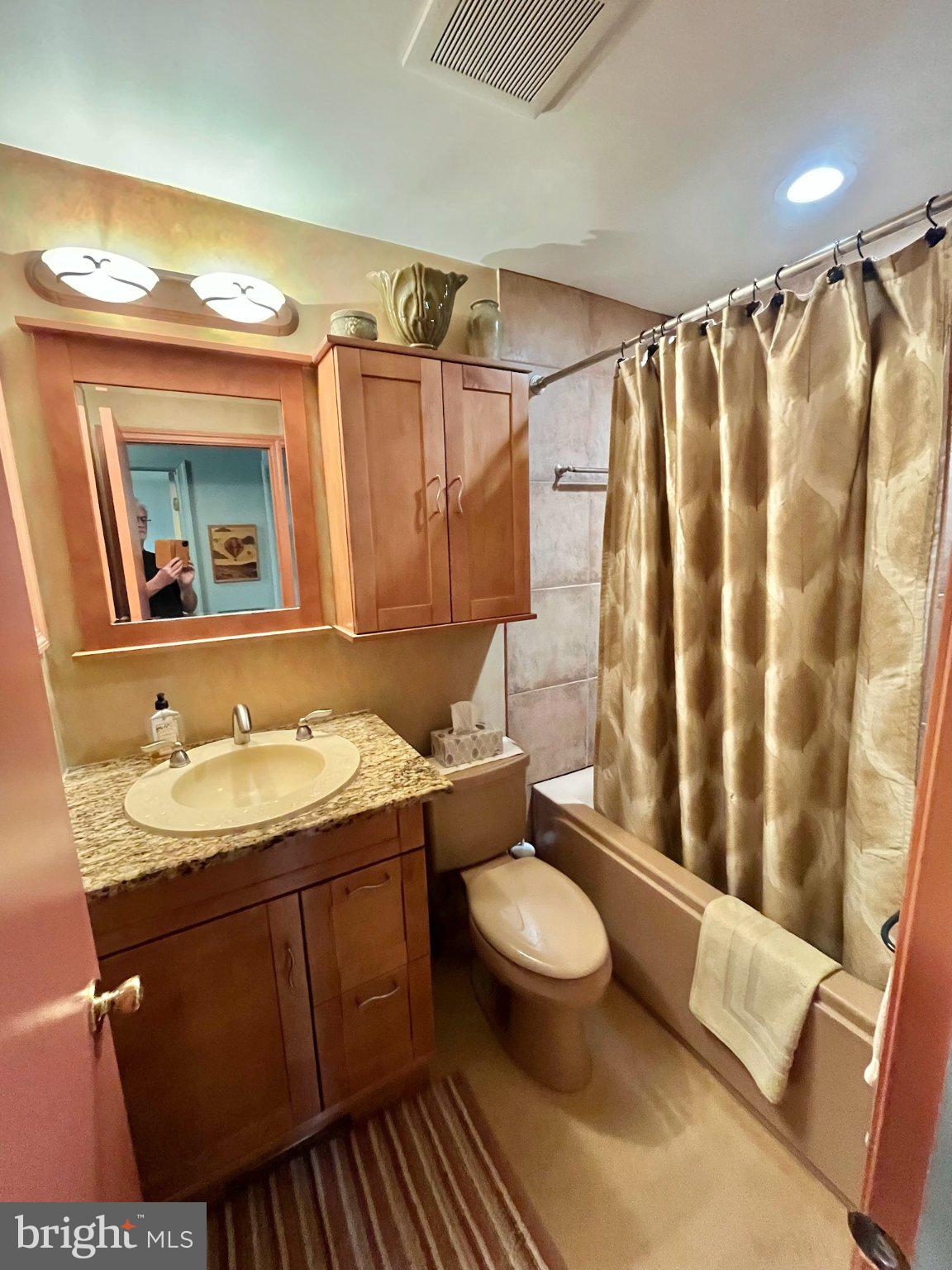 107 Carousel Circle Doylestown, PA 18901 - Photo 18 of 31 a bathroom with a granite countertop sink toilet and mirror