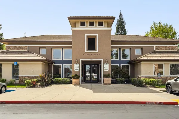 a living room with furniture windows and wooden floor