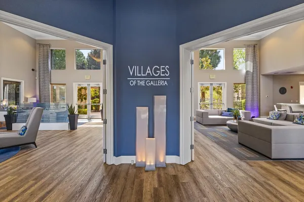 a bedroom with furniture and a wooden floor