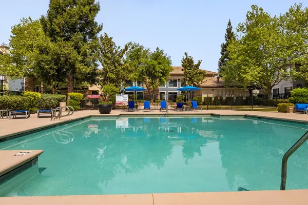 a view of a park with swings and slides