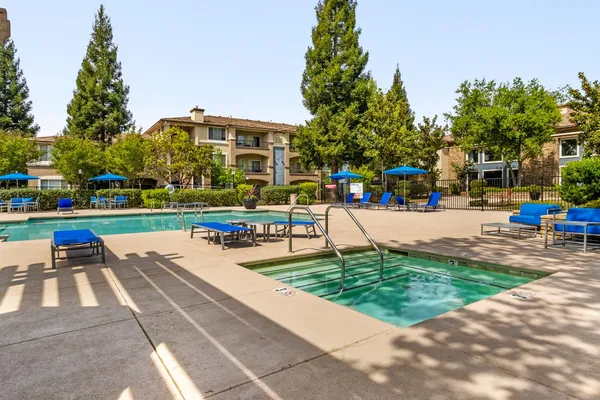 an outdoor sitting area with furniture and patio area