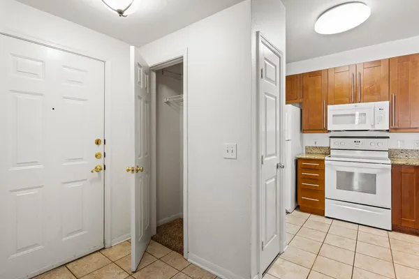 a kitchen with a refrigerator sink and stove