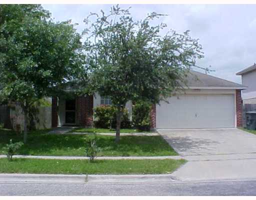 7925 Elk Drive, Unit 1 Corpus Christi, TX 78414 - Photo 1 of 8 a front view of a house with a yard and garage