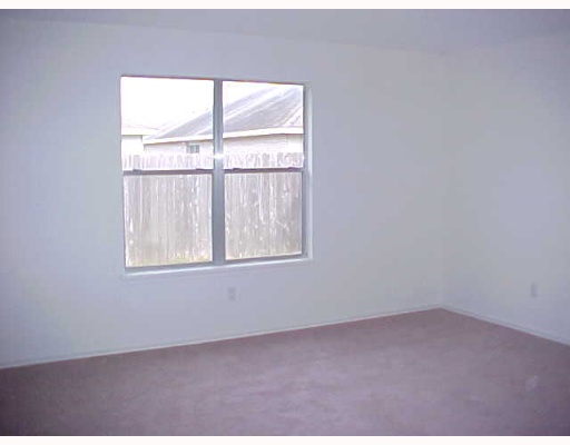 7925 Elk Drive, Unit 1 Corpus Christi, TX 78414 - Photo 5 of 8 an empty room with a window
