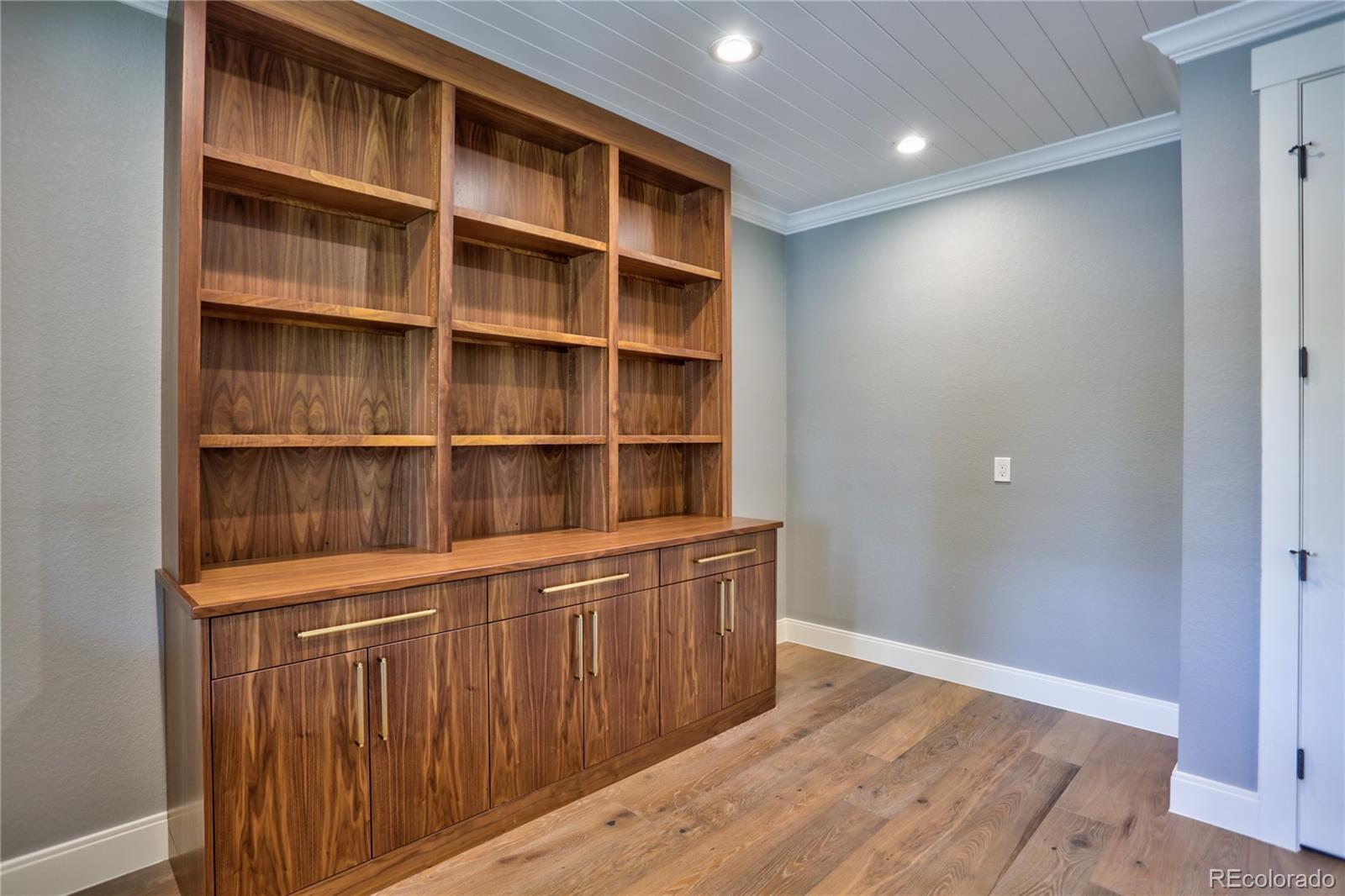 2732 South Jackson Street Denver, CO 80210 - Photo 15 of 40 a view of a room with empty racks