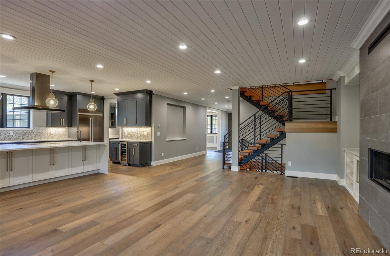2732 South Jackson Street Denver, CO 80210 - Photo 17 of 40 a view of a kitchen with chairs and wooden floor