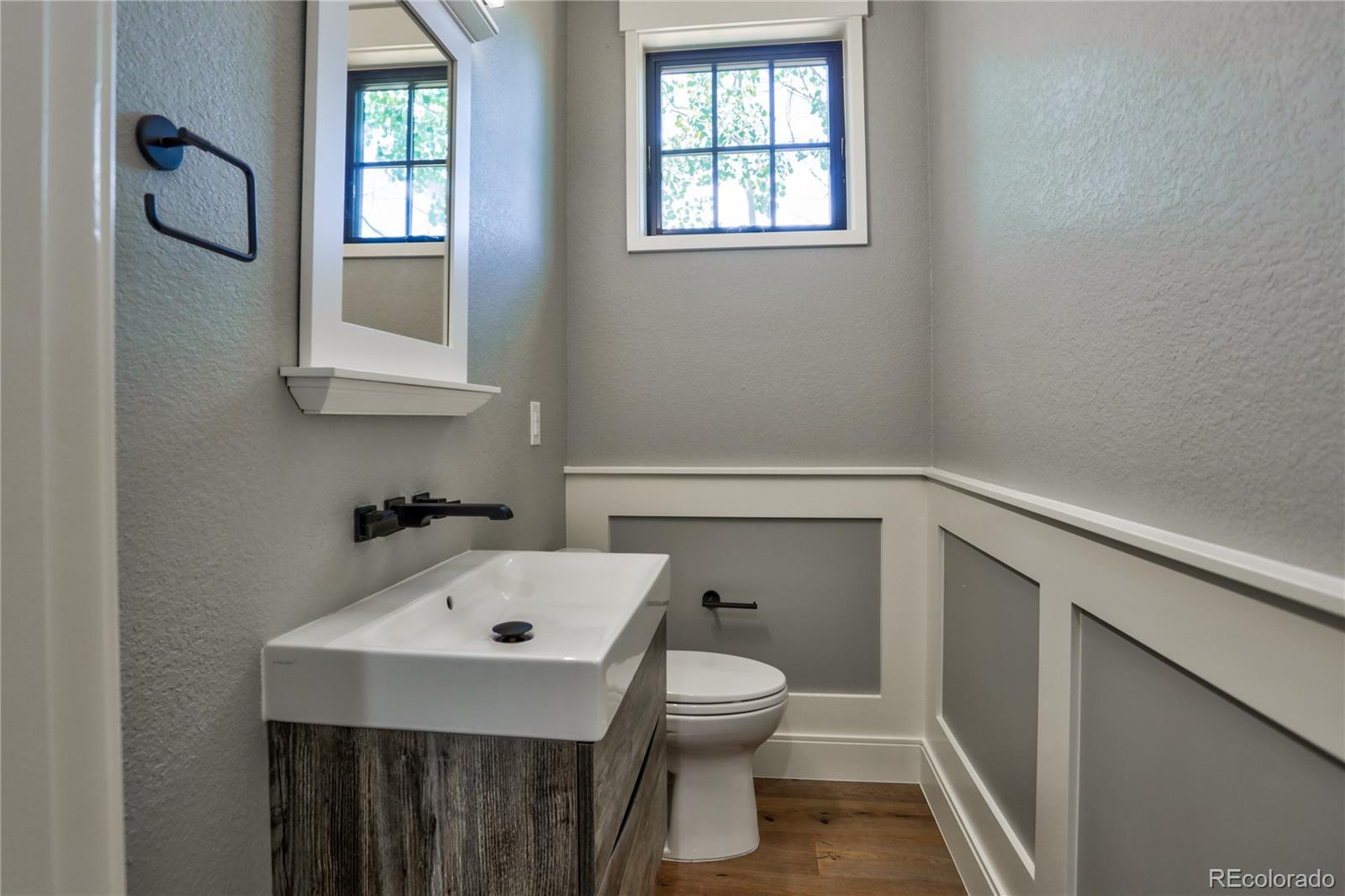 2732 South Jackson Street Denver, CO 80210 - Photo 20 of 40 a bathroom with a sink toilet and window