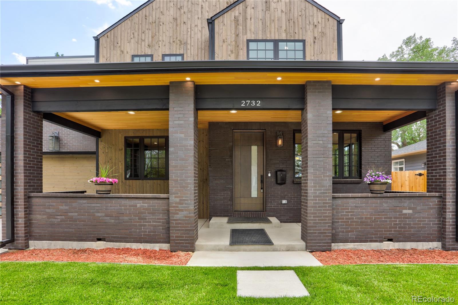 2732 South Jackson Street Denver, CO 80210 - Photo 2 of 40 a view of a house with a yard