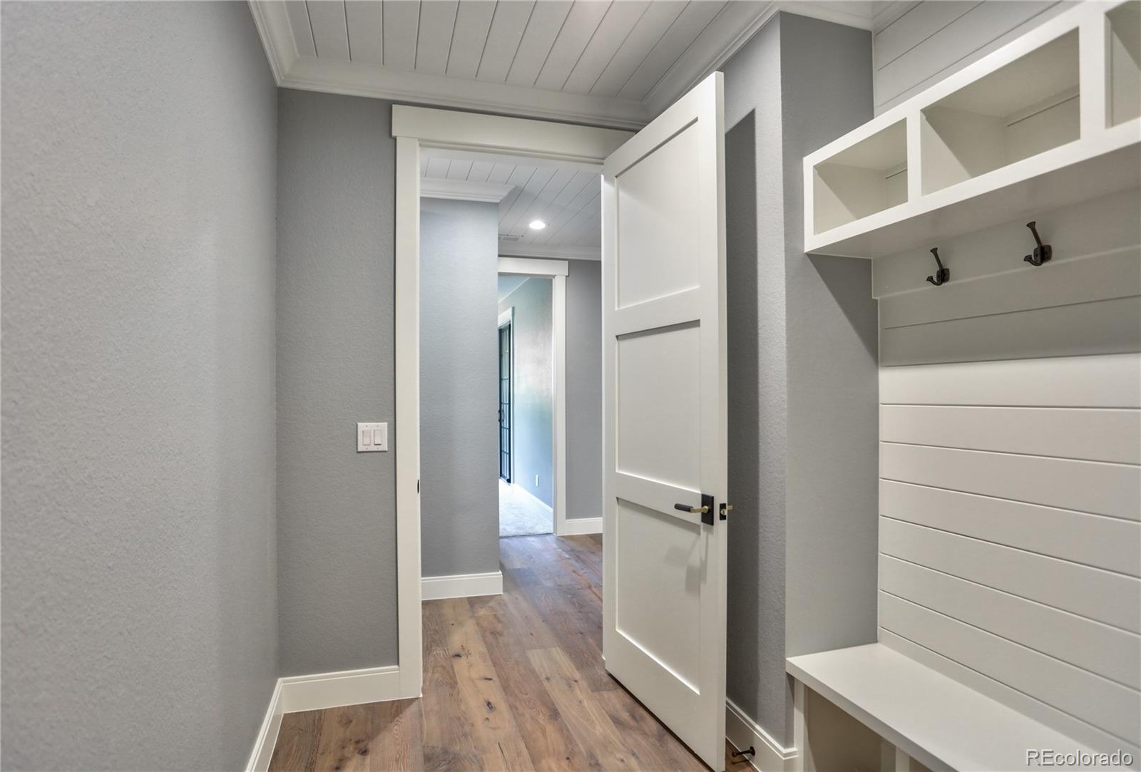 2732 South Jackson Street Denver, CO 80210 - Photo 21 of 40 a view of a hallway with closet and wooden floor