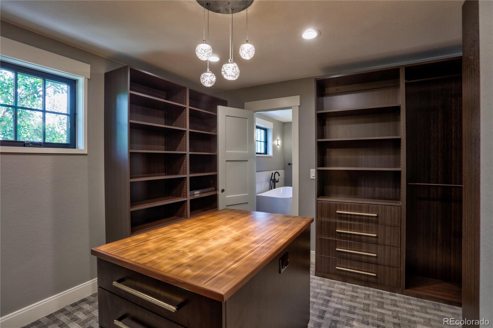 2732 South Jackson Street Denver, CO 80210 - Photo 29 of 40 a room with furniture and wooden floor