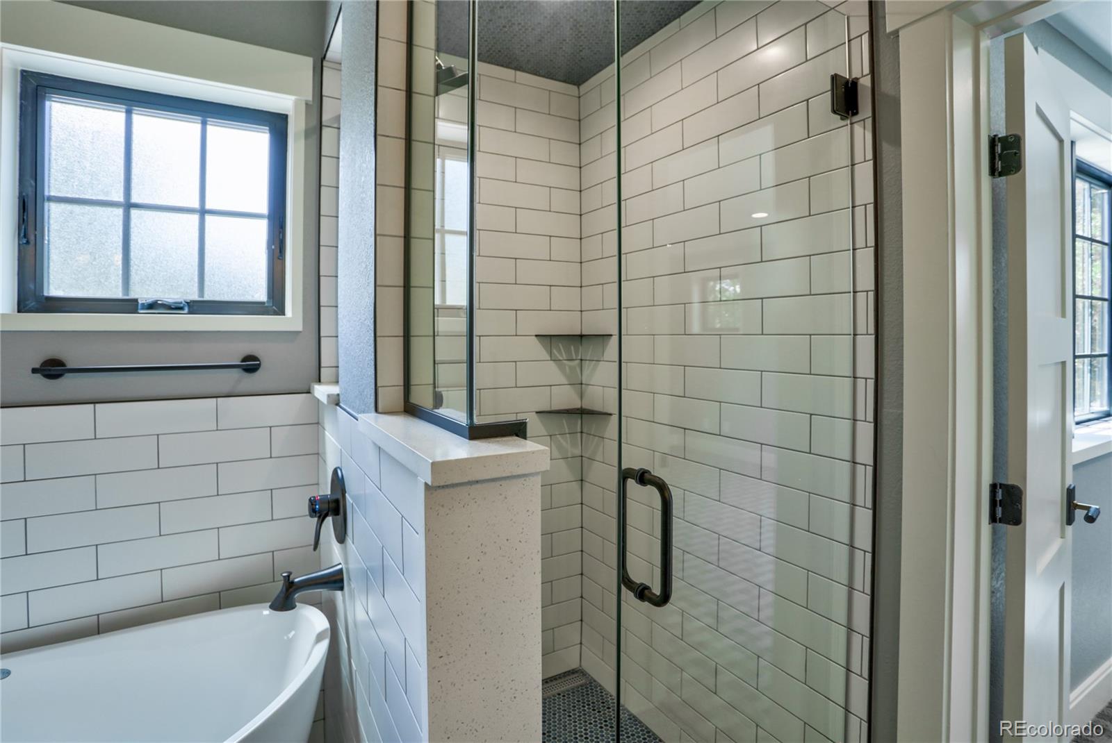 2732 South Jackson Street Denver, CO 80210 - Photo 33 of 40 a bathroom with a bathtub and shower