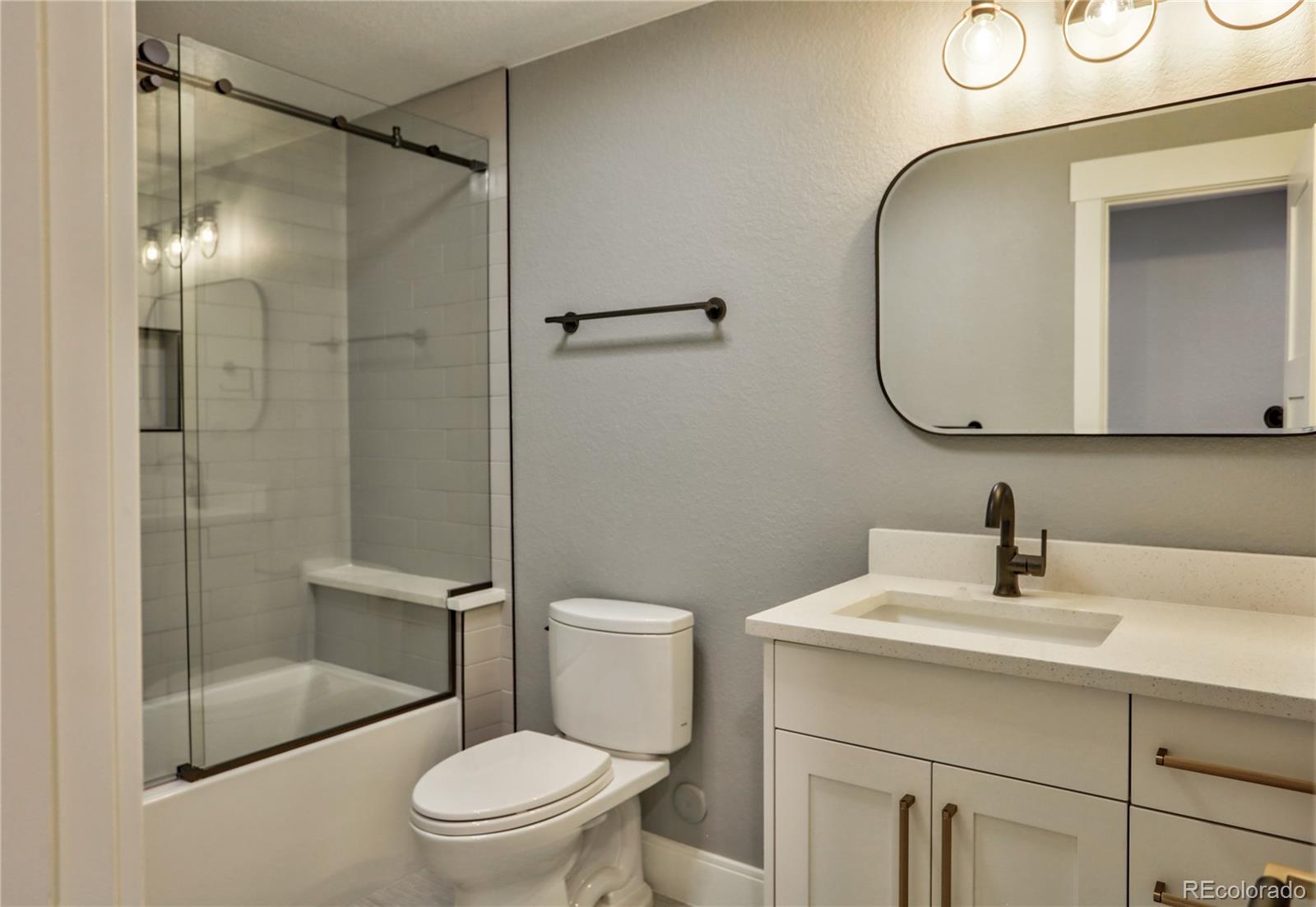 2732 South Jackson Street Denver, CO 80210 - Photo 39 of 40 a bathroom with a sink toilet and shower