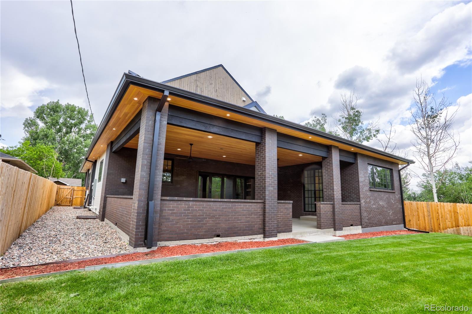 2732 South Jackson Street Denver, CO 80210 - Photo 4 of 40 a view of a house with yard and a garden