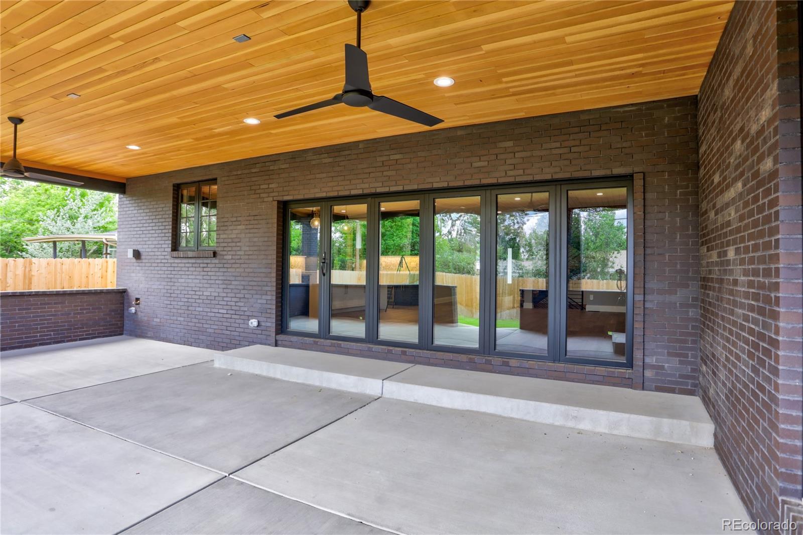 2732 South Jackson Street Denver, CO 80210 - Photo 5 of 40 a spacious bedroom with a large bed and large windows