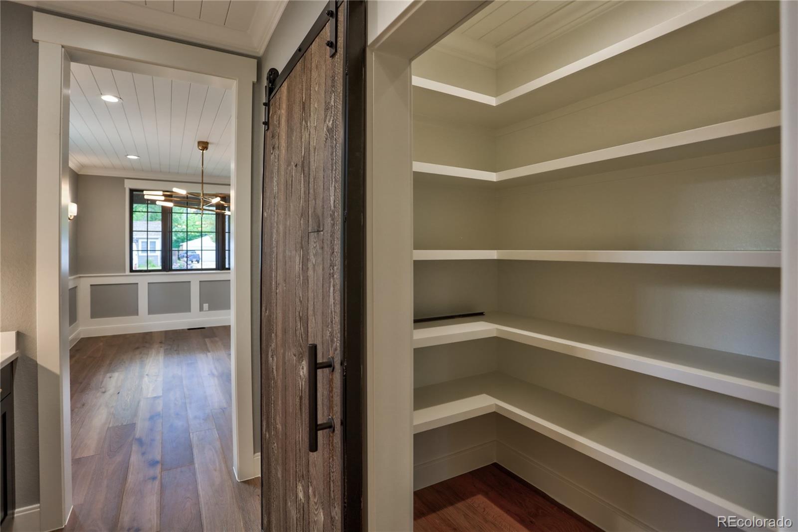 2732 South Jackson Street Denver, CO 80210 - Photo 9 of 40 a view of a hallway with wooden floor