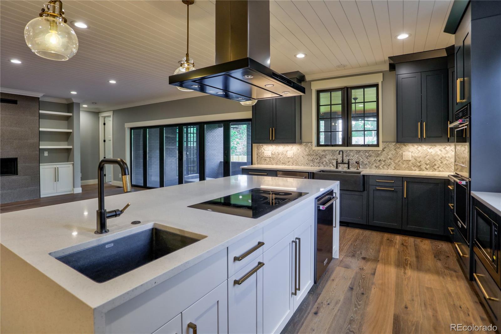 2732 South Jackson Street Denver, CO 80210 - Photo 10 of 40 a kitchen with stainless steel appliances granite countertop a sink and a stove