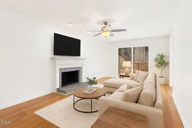 a view of a kitchen with wooden floor and electronic appliances