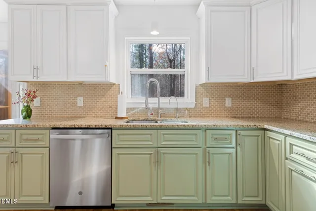 a view of a room with wooden floor and white walls