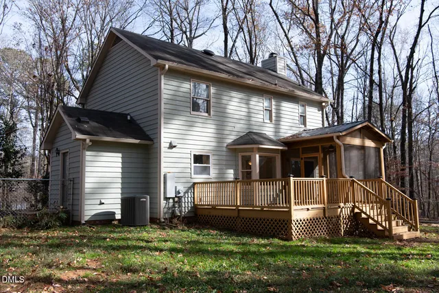 a view of a chairs in a backyard