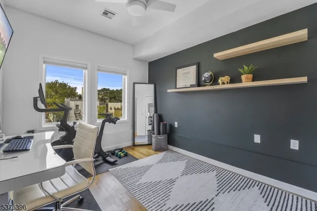 a room with gym equipment and a large window