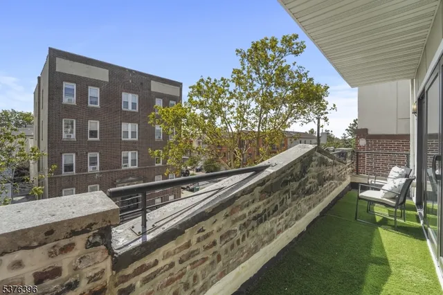 a view of balcony with a potted plant