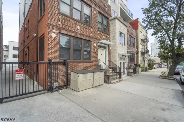 a view of a brick building with many windows