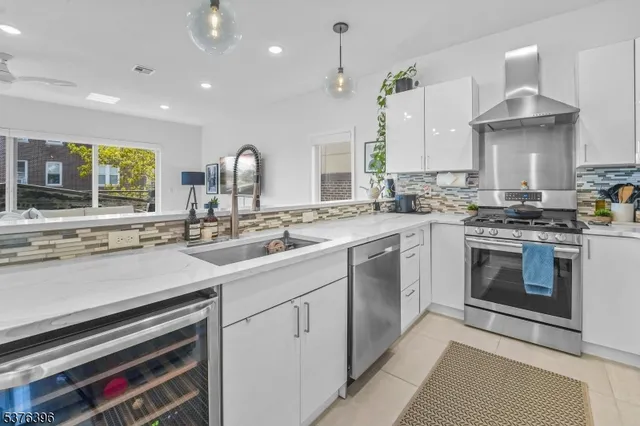 a kitchen with a stove oven and sink