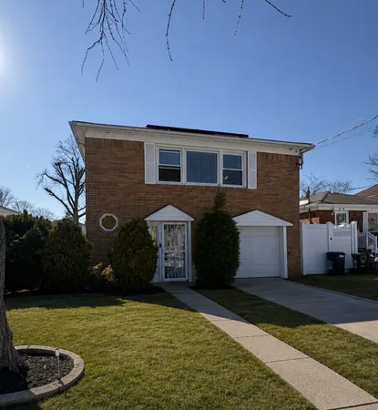 a front view of a house with yard