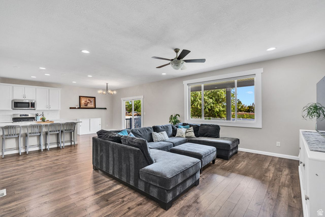 3269 West 650 North Layton, UT 84041 - Photo 8 of 35 Open-concept living area featuring wood-finish flooring, recessed lighting, and a ceiling fan