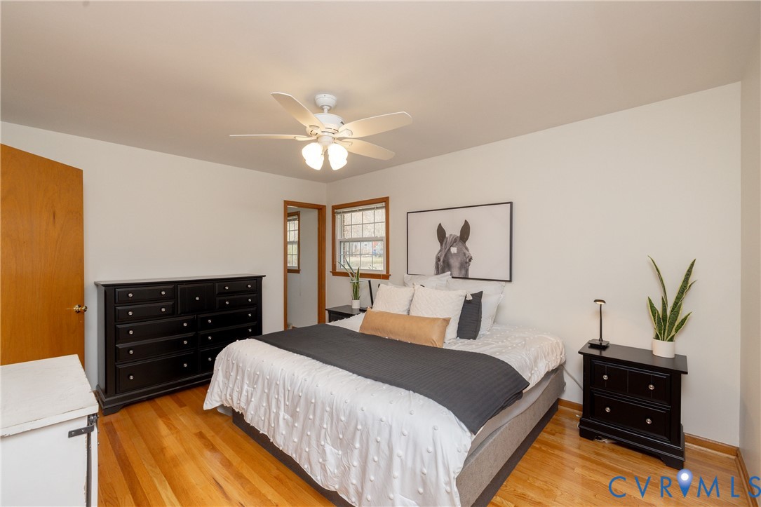 42 Maple Lane Blackstone, VA 23824 - Photo 16 of 35 a bedroom with a bed and a chandelier