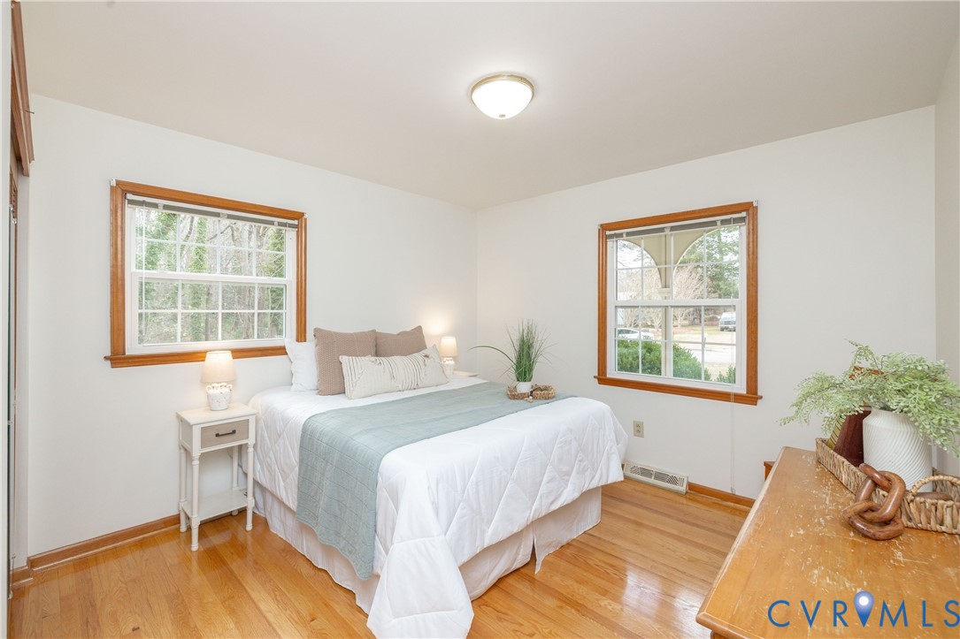 42 Maple Lane Blackstone, VA 23824 - Photo 20 of 35 a bedroom with a bed and wooden floor