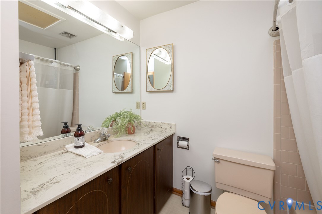 42 Maple Lane Blackstone, VA 23824 - Photo 24 of 35 a bathroom with a granite countertop sink a toilet and a mirror