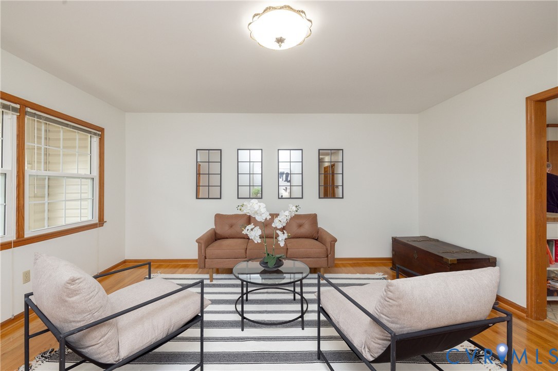 42 Maple Lane Blackstone, VA 23824 - Photo 5 of 35 a living room with furniture and a potted plant