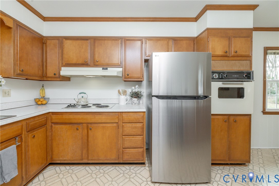 42 Maple Lane Blackstone, VA 23824 - Photo 10 of 35 a kitchen with stainless steel appliances granite countertop a refrigerator a stove and a sink