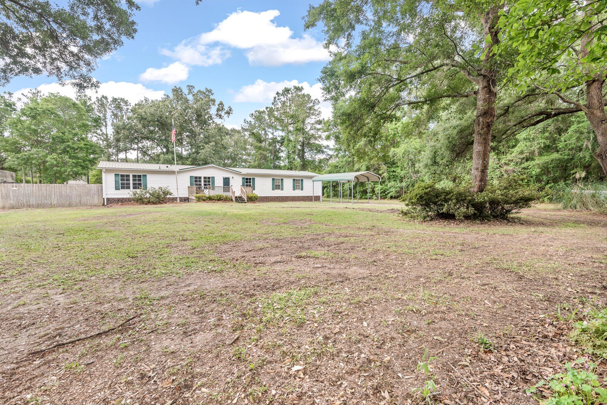 3897 State Rd S-10-1333 Johns Island, SC 29455 - Photo 2 of 36 Large front yard with mature trees