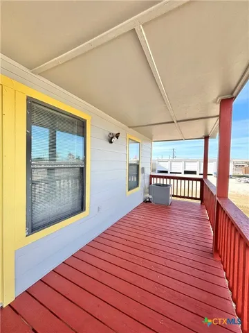 a view of a swimming pool with outdoor seating