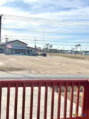 a kitchen with stainless steel appliances a refrigerator a stove and white cabinets