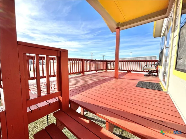 a view of a swimming pool with an outdoor seating