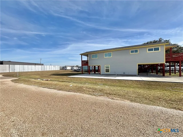 a view of a living room and floor to ceiling window
