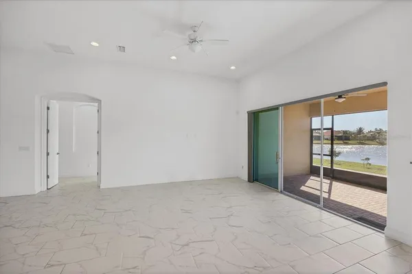 a kitchen with stainless steel appliances granite countertop a sink a stove and a refrigerator