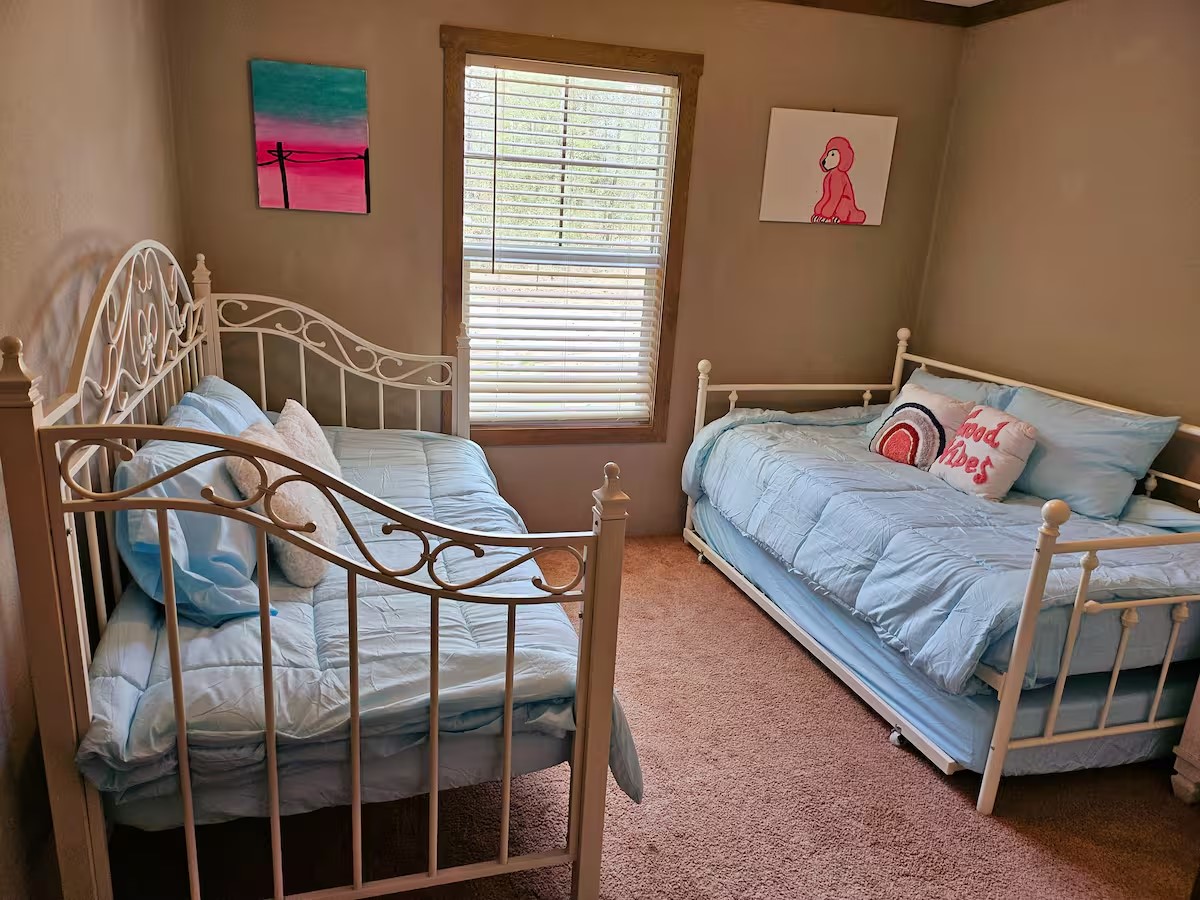 105 Saddle Surrey Road Coldspring, TX 77331 - Photo 30 of 48 a bedroom with a bed and a window