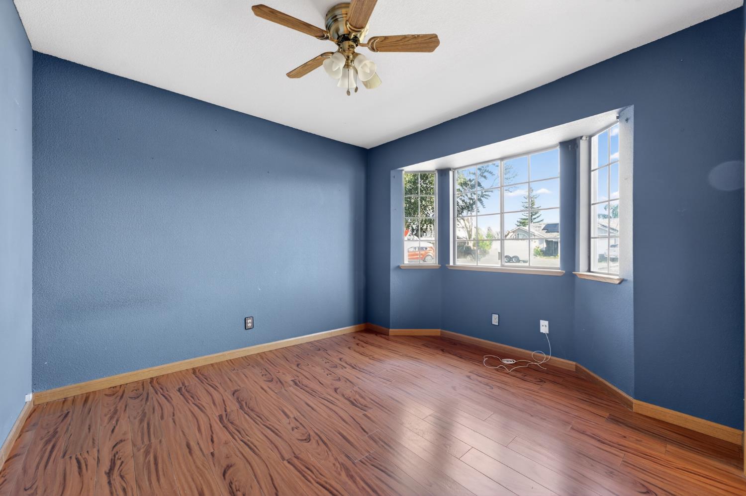 622 Q Street Lincoln, CA 95648 - Photo 11 of 25 a view of empty room with wooden floor and fan
