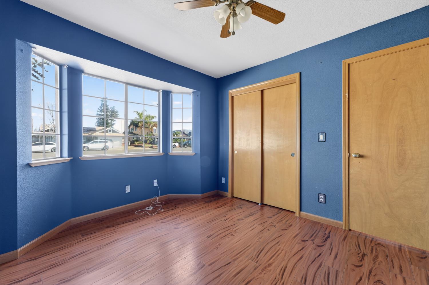 622 Q Street Lincoln, CA 95648 - Photo 12 of 25 a view of an empty room with window and wooden floor