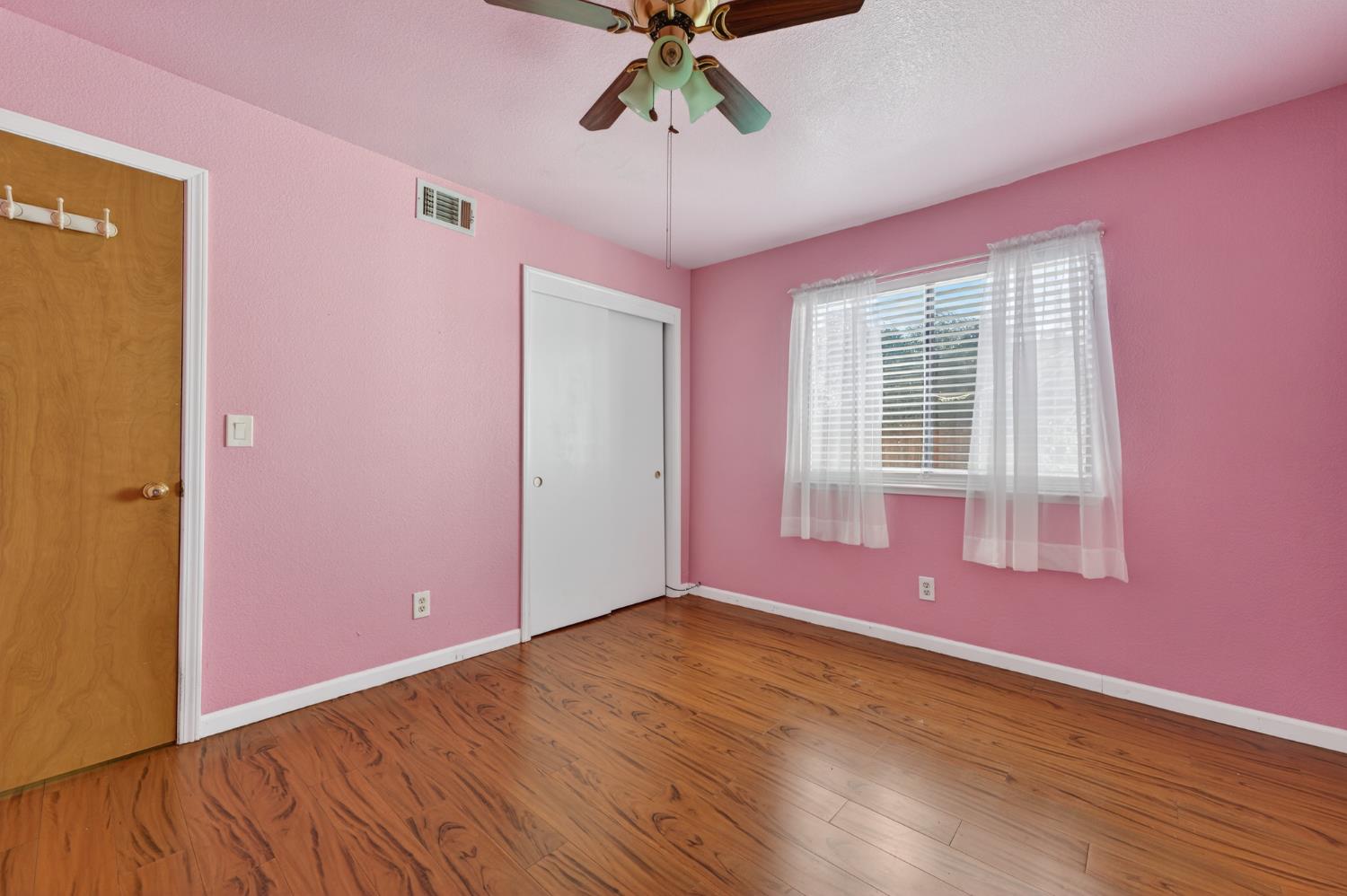 622 Q Street Lincoln, CA 95648 - Photo 14 of 25 a view of empty room with wooden floor and fan
