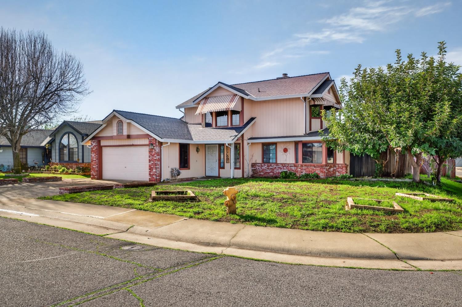 622 Q Street Lincoln, CA 95648 - Photo 2 of 25 a front view of a house with a yard and garage