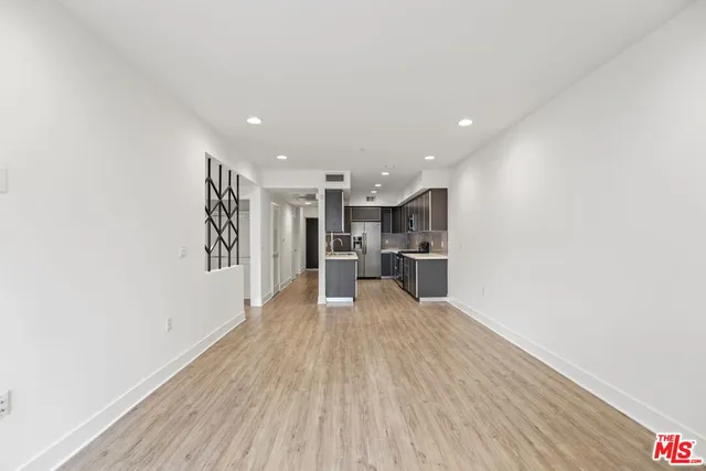 a view of kitchen with wooden floor