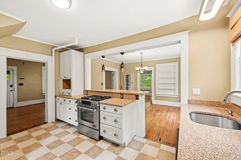 a kitchen with stainless steel appliances granite countertop a sink and cabinets