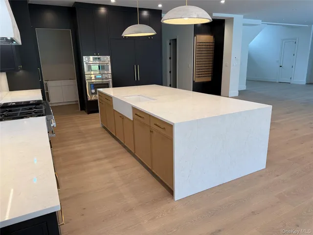 a large room with a large counter top and sink